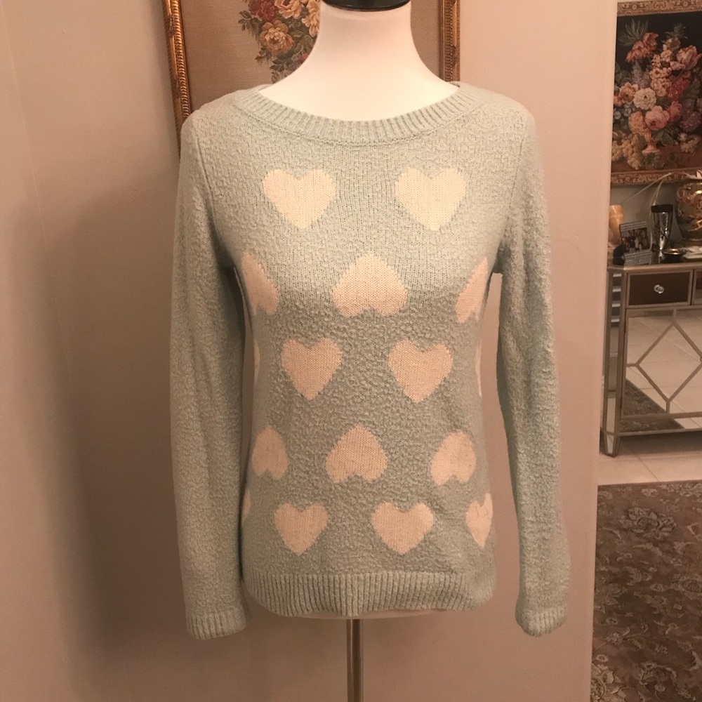 light blue sweater with patterned hearts